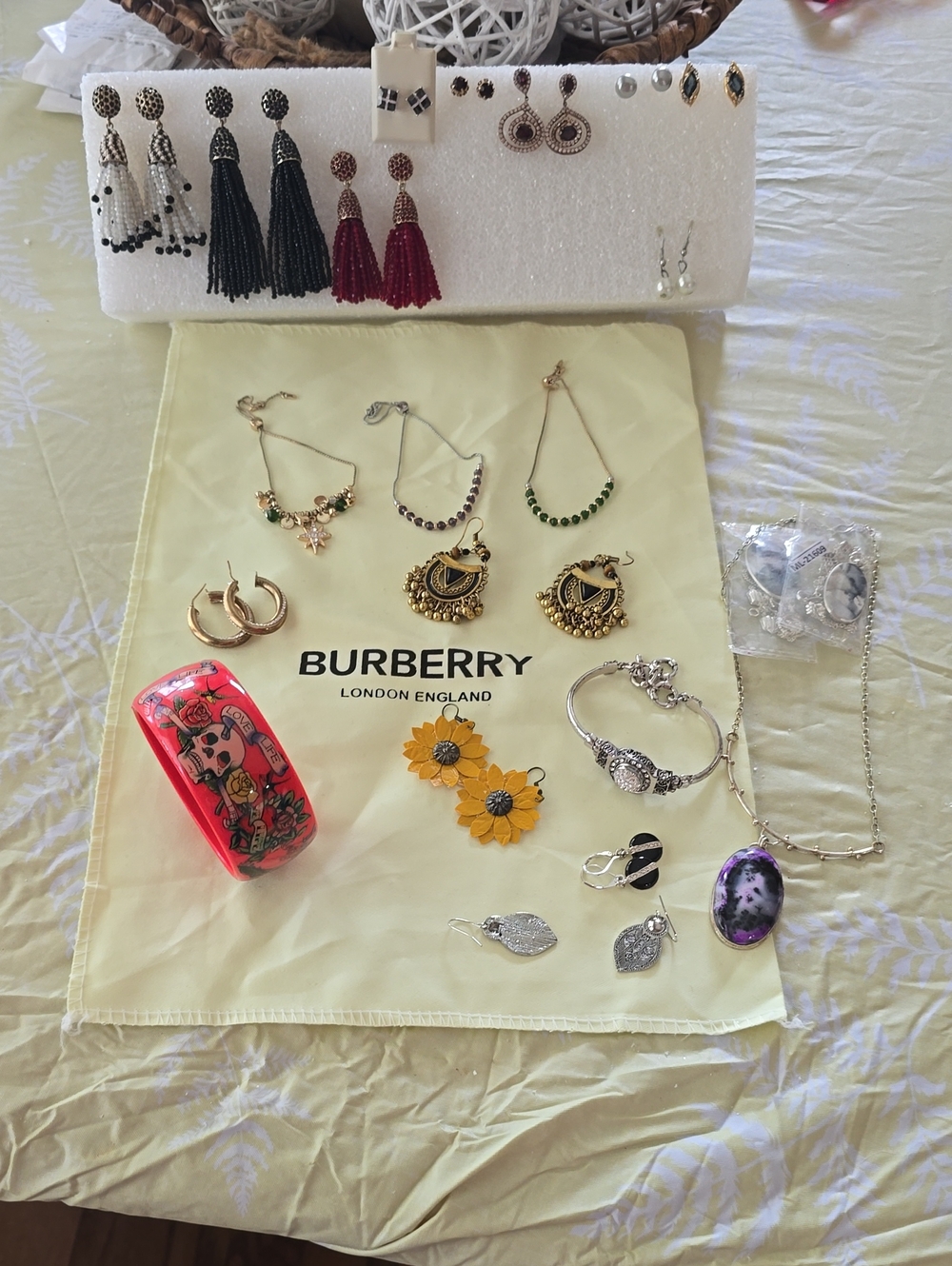 Burberry Yellow Jewelry Display with Assorted Earrings and Accessories